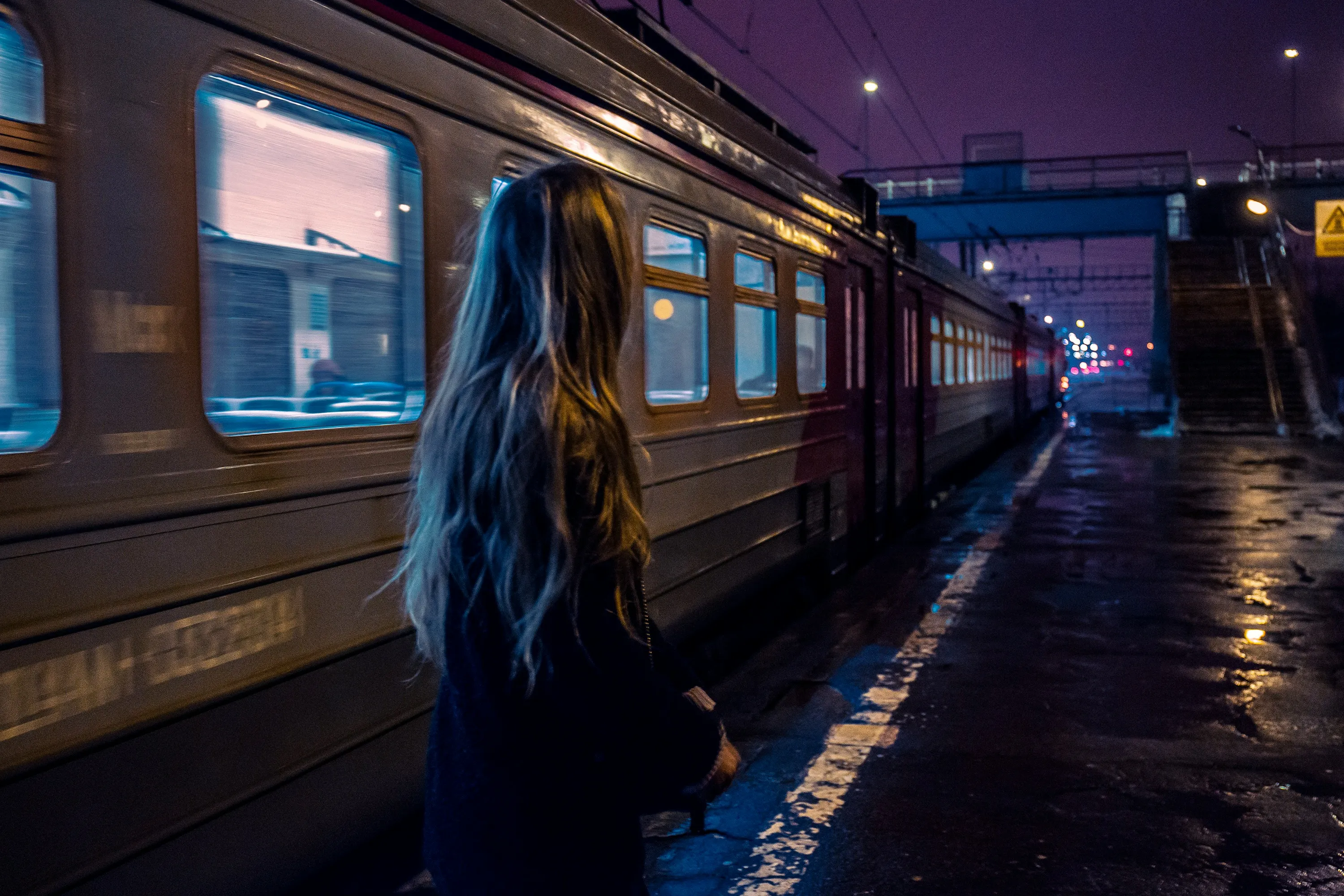 girl next to a train